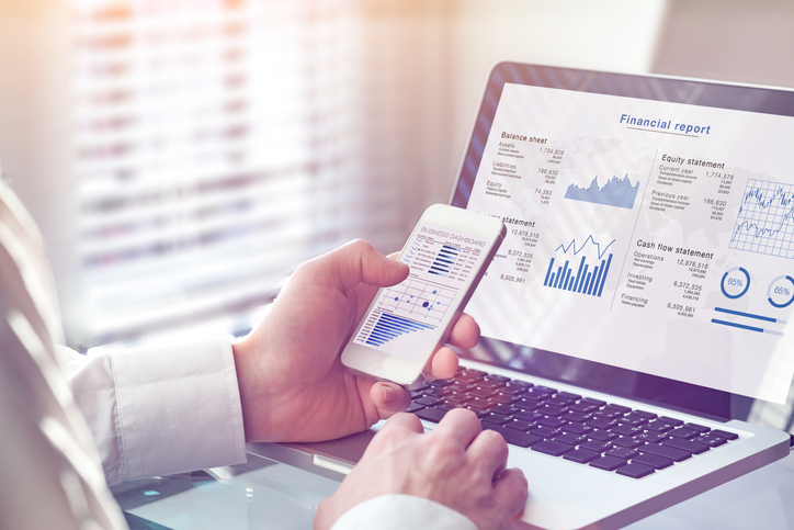 Accountant looking at cash flow analytics and data